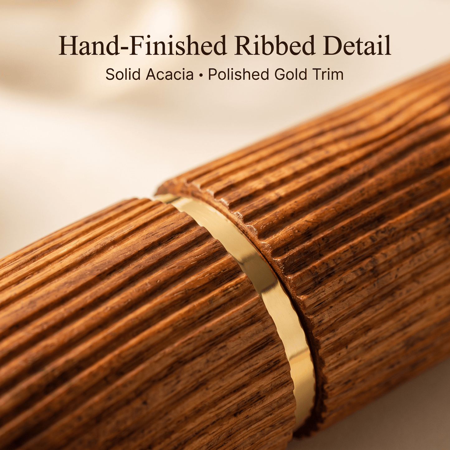 Hand-finished ribbed acacia detail with polished gold trim